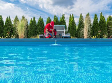 Professional Swimming Pools Technician Performing Seasonal Maintenance